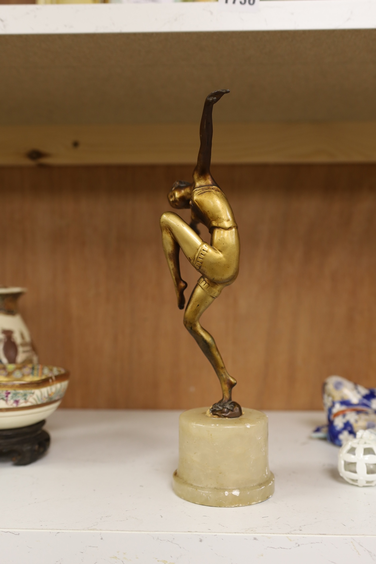 A gilt patinated spelter dancing figure after Chiparus, 27cm high. Condition - front of base of figure at the feet broken